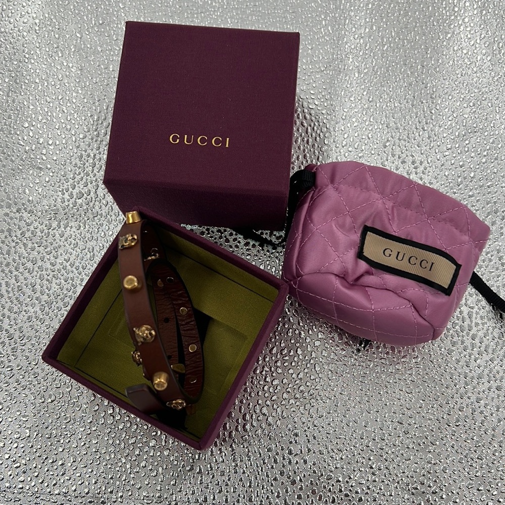 Gucci lion head.  Wear doubled as bracelet or as choker